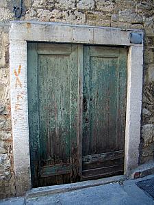 This is the door from the street into our apartment. In real life, it looks even more rickety than it does in this photo. We like its "character"! 