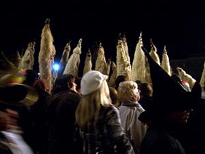 Crazy carnival costumes - about a dozen guys wearing these crazy hats.