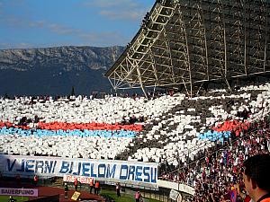 The Torcida fans holding up posters to create a cool display in the stands.