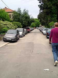 Showing off how the cars park on the sidewalk here.