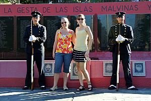 Buenos Aires - Kyleen and Kelly posing with armed guards at a memorial. Even though they don't show it in this photo, these guards were very entertaining, making funny poses. Most of our experiences with guards like these in other countries, they are very still and proper. But not here - was fun!