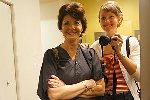 Kelly and Mom showing off their new hairdos through a mirror.