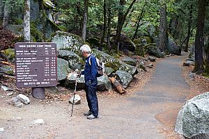 Dad Klocke reviewing the mileage to the top of Nevada fall, our destination. 9 miles round trip (we hiked a mile to get to this point), covering an elevation rise of 2000 feet.