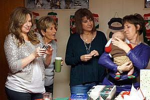 Nana Larbes with her three daughters, admiring Cooper