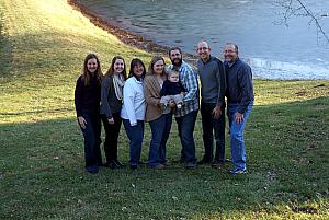 The whole family, in front of the frozen lake.