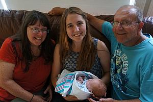 Grandma and Grandpa and Aunt Julie Larbes visiting with Capri at home.