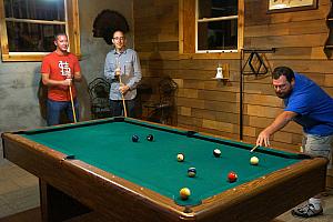 Dudes playing pool.