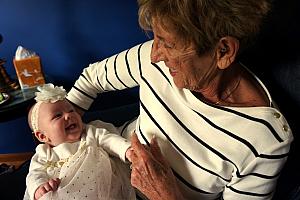 Capri giving Great Grandma lots of smiles and giggles.