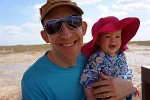 Daddy and Daughter smiling for the camera.