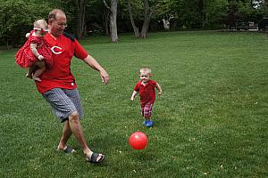 Birthday party in full swing -- Papa Jim playing with Capri and Cooper