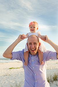 Capri cheesing it up on Dad's shoulders.