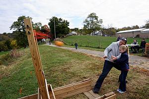 Mike and Cardin slinging a pumpkin