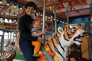 Capri and Grammy riding the Carousel