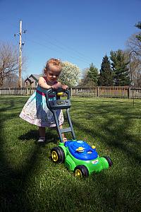 Capri giving the lawnmower a go