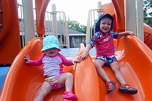 Capri and Kenley sliding at Sharon Woods park