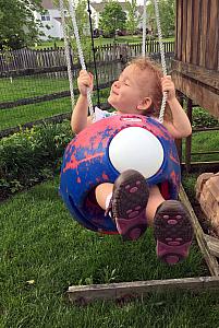 Capri enjoying the swings