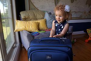 Playing with her new suitcase